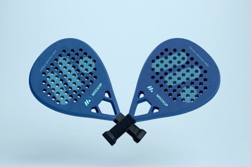 Blue padel rackets mockup Two blue padel rackets crossed against a light background