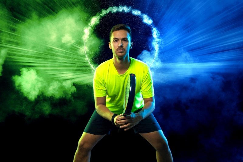 Confident padel portrait Senior padel player posing with a racket in black and white