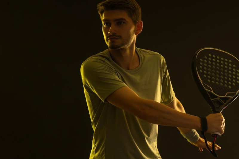 Focused padel backhand Padel player preparing for a backhand stroke