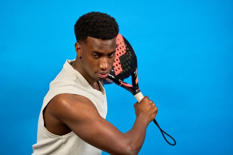 Focused padel player Padel player preparing for a powerful shot