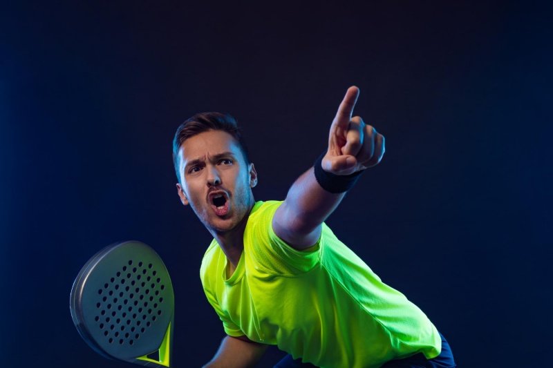 Intense padel match moment Passionate padel player pointing and reacting