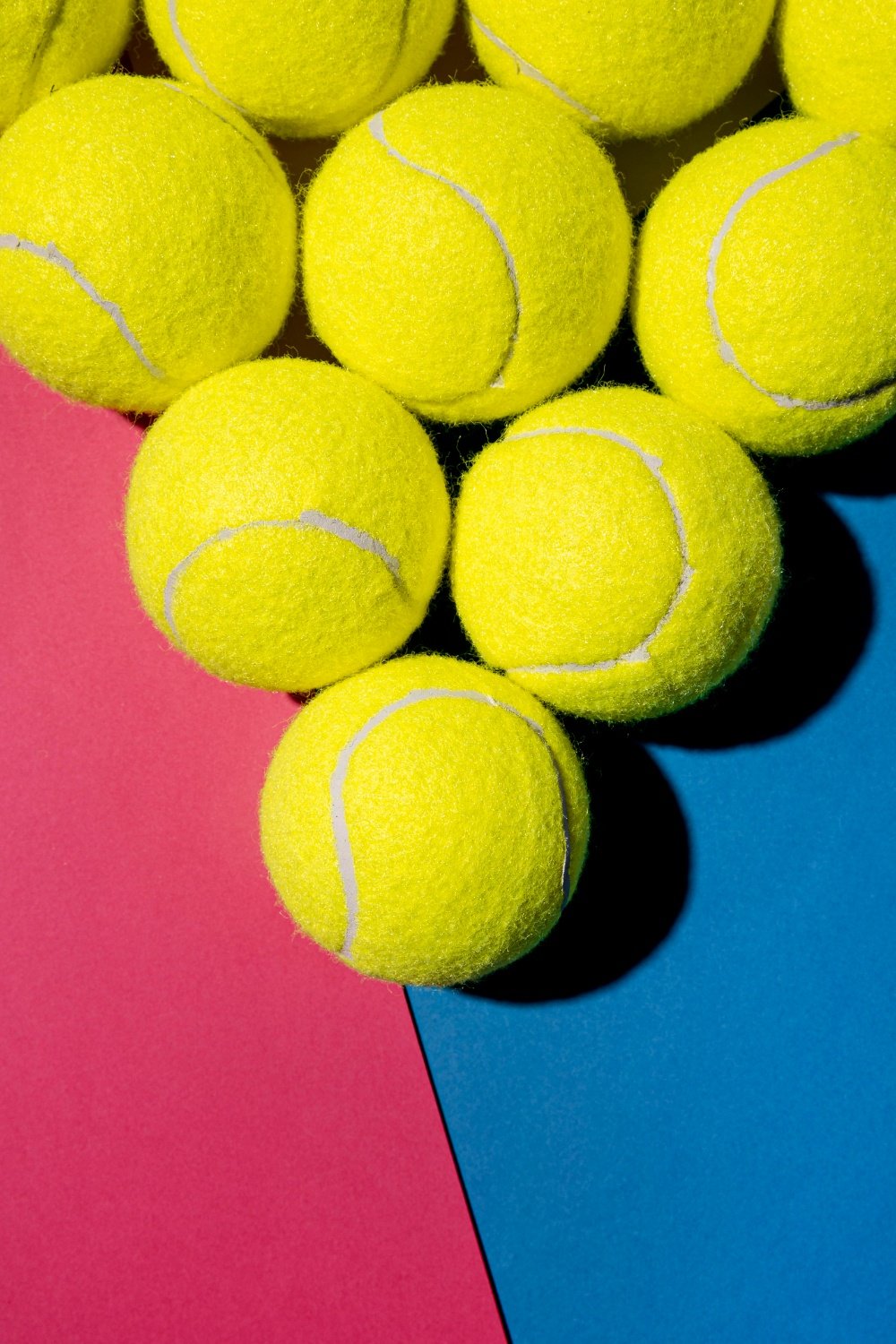 Padel Balls Color Contrast Padel balls on pink and blue background