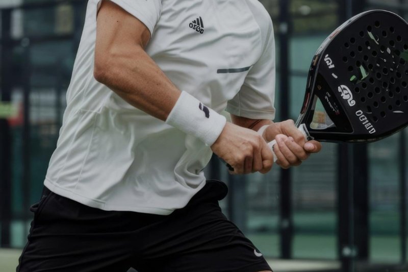 Padel backhand preparation Padel player preparing for a backhand shot
