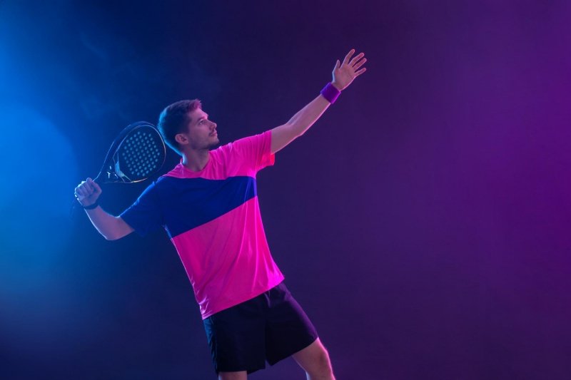 Padel smash preparation Padel player preparing for a powerful smash, focused stance