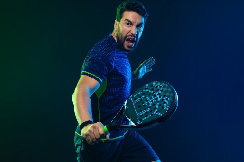 Powerful padel action moment Intense padel player ready to strike