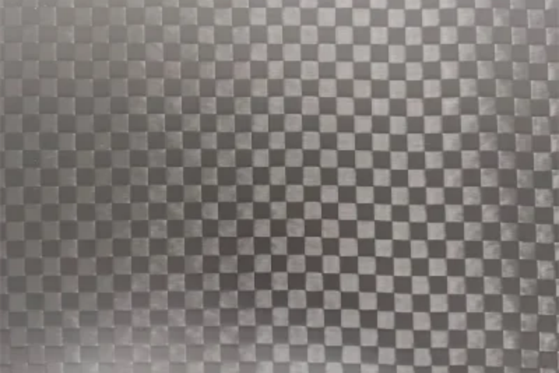 Carbon Fiber Surface close-up view of carbon fiber texture with checkerboard pattern