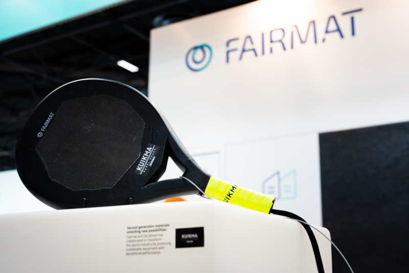 Padel Racket Display black padel racket with yellow grip displayed at Fairmat exhibition booth