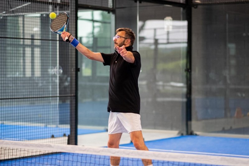 Padel Overhead Shot Padel player prepares for overhead shot during indoor practice